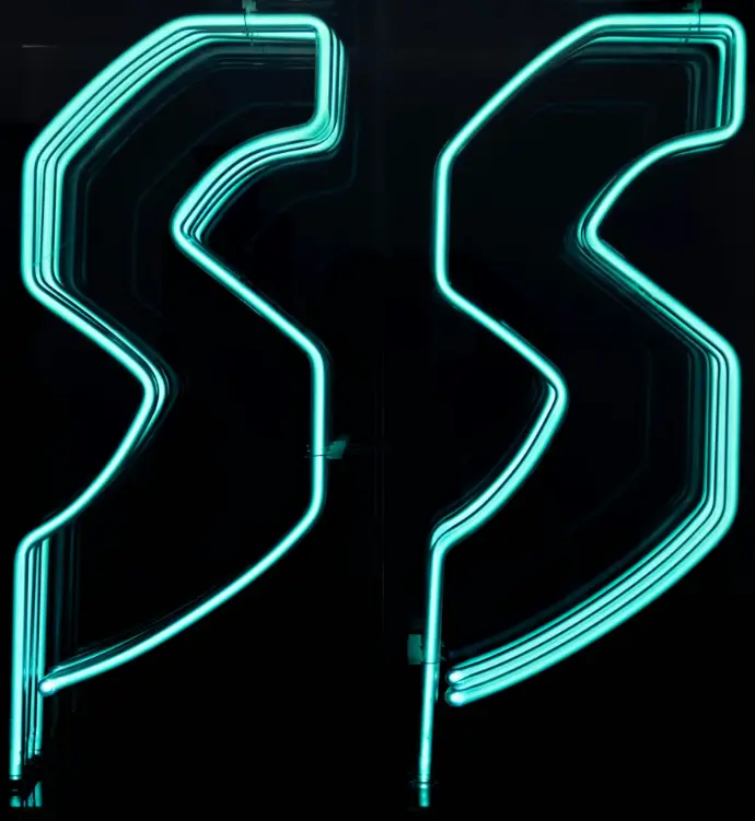 a black background with a green neon sign